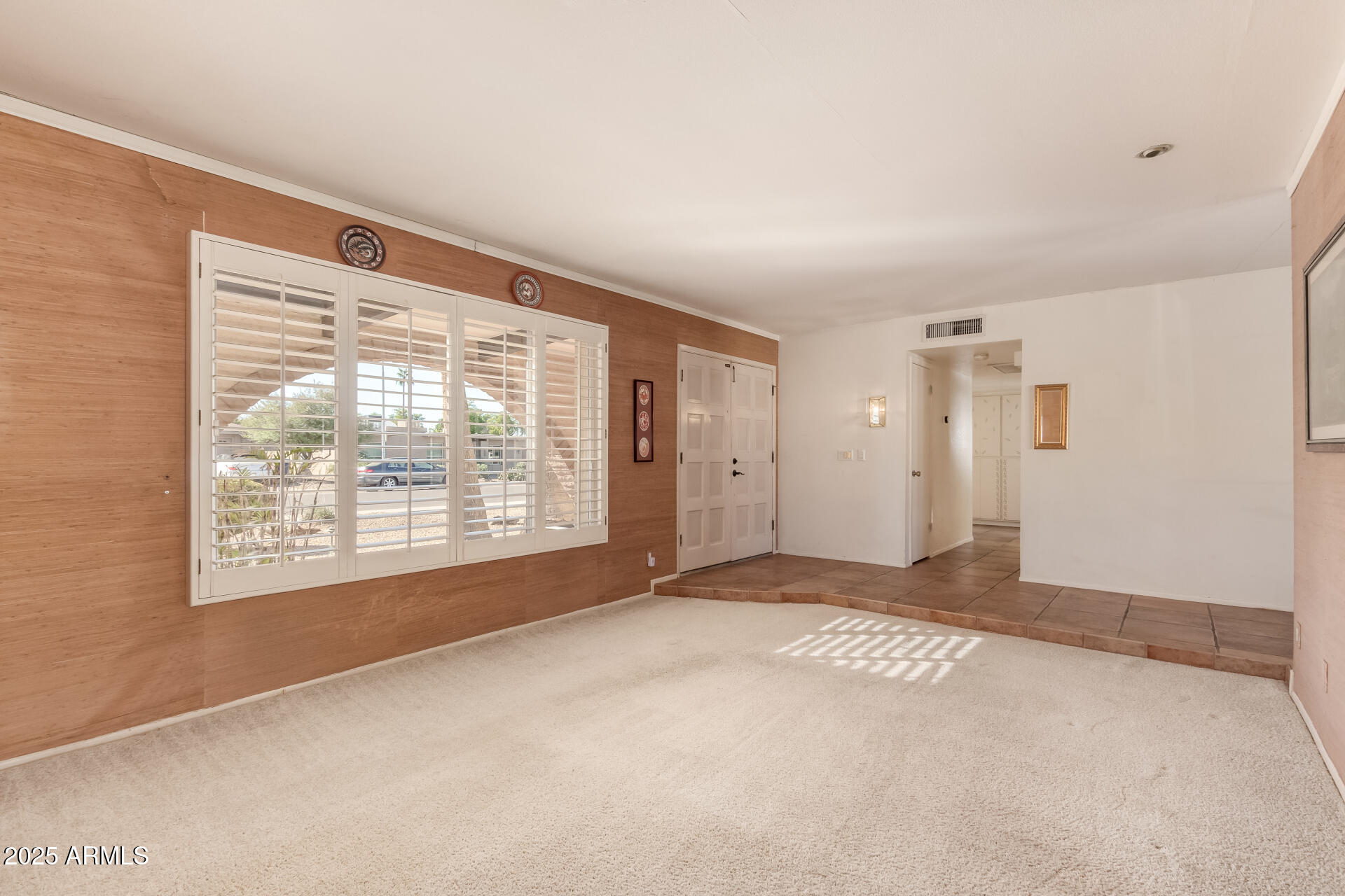 1220 East Julie Drive Tempe, AZ 85283 - Photo 5 of 32 a view of an empty room with a window