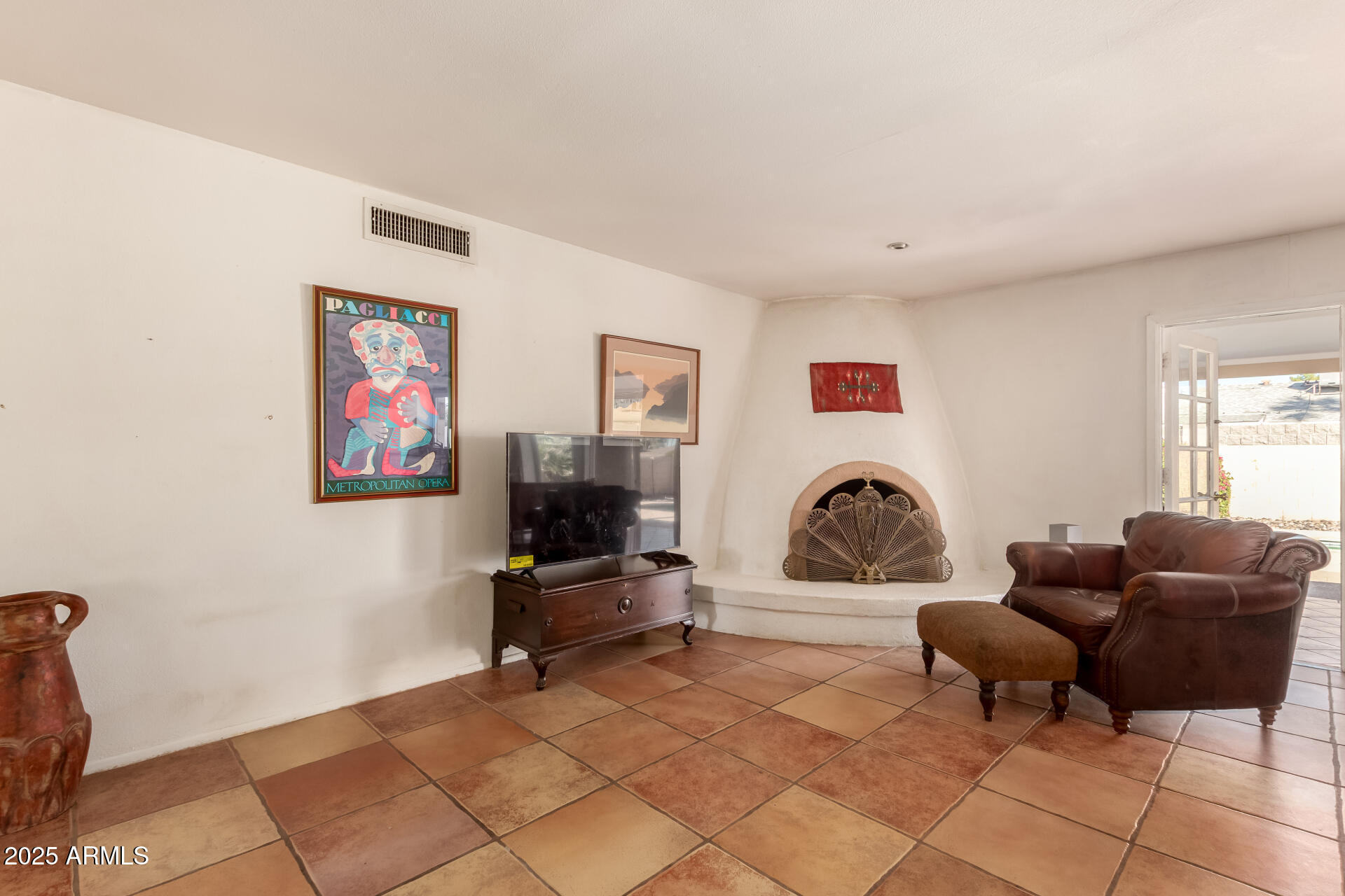 1220 East Julie Drive Tempe, AZ 85283 - Photo 9 of 32 a living room with furniture a rug and a flat screen tv