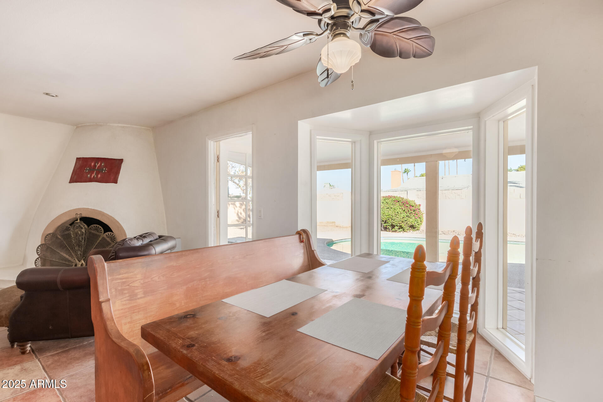 1220 East Julie Drive Tempe, AZ 85283 - Photo 10 of 32 a view of a dining room with furniture and a large window