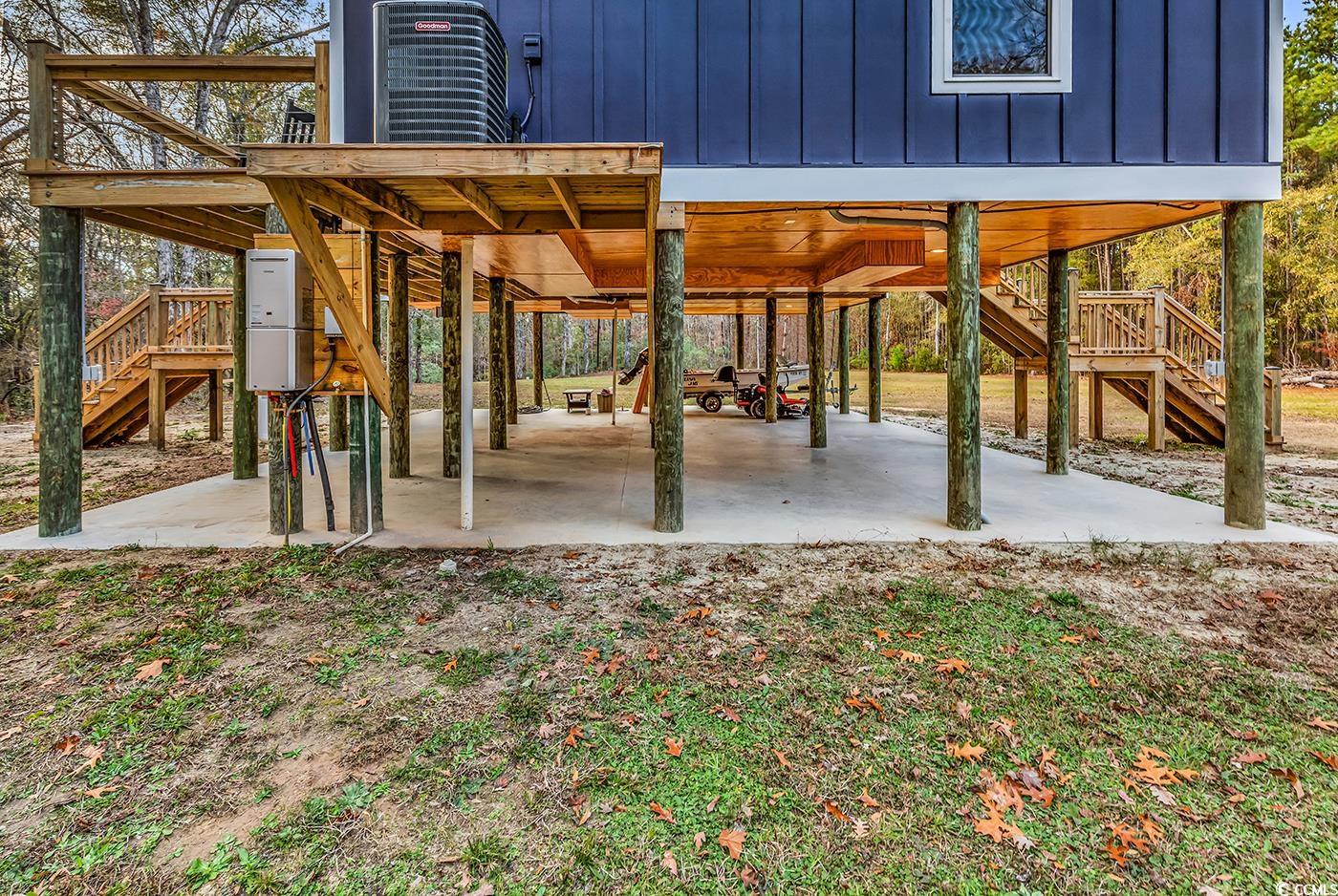 32 Old Place Kingstree, SC 29556 - Photo 23 of 40 View of patio featuring stairs, a carport, and a deck