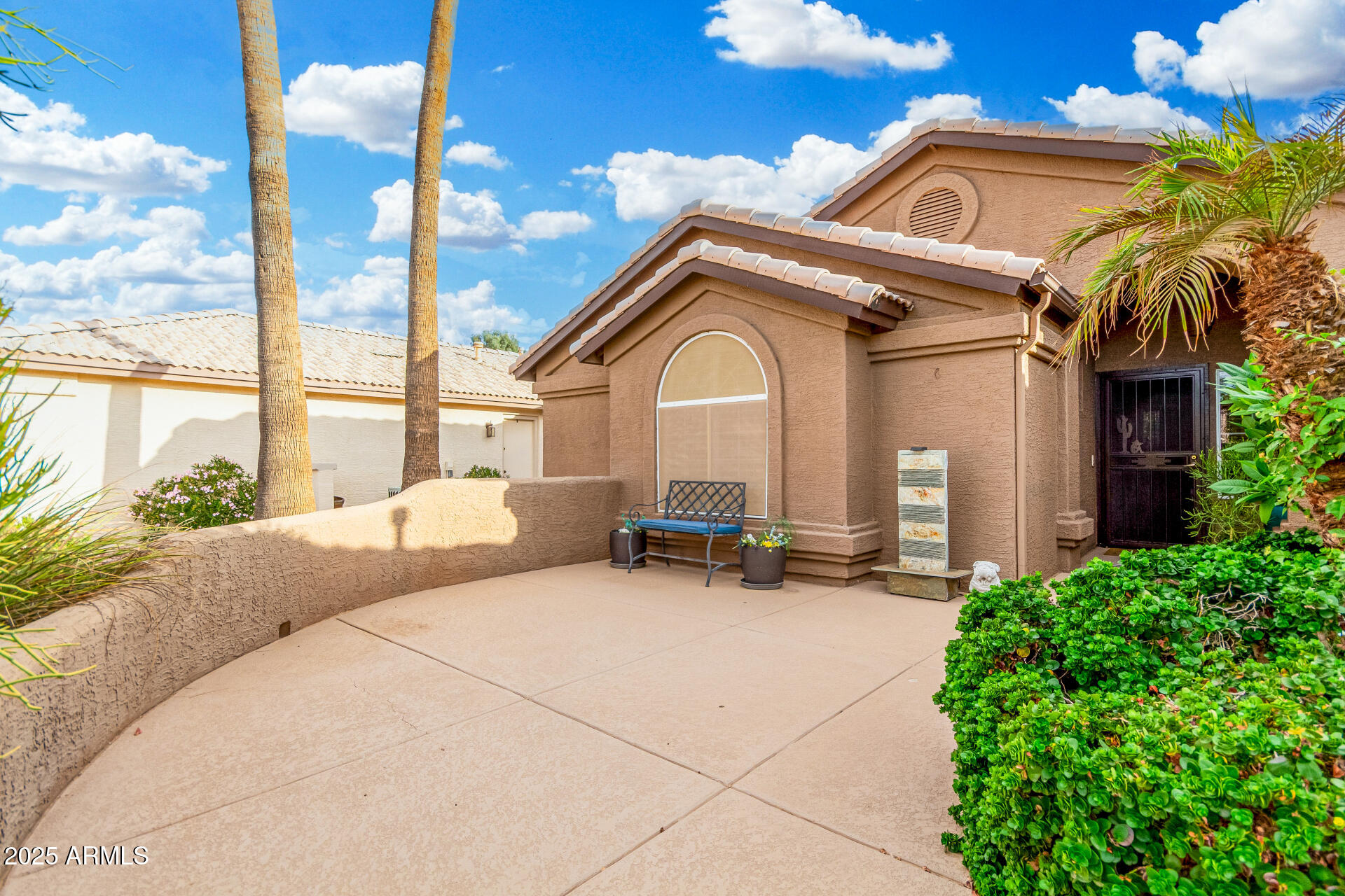 15531 Piccadilly Road Goodyear, AZ 85395 - Photo 13 of 54 a view of a chair and tables in the patio next to a yard