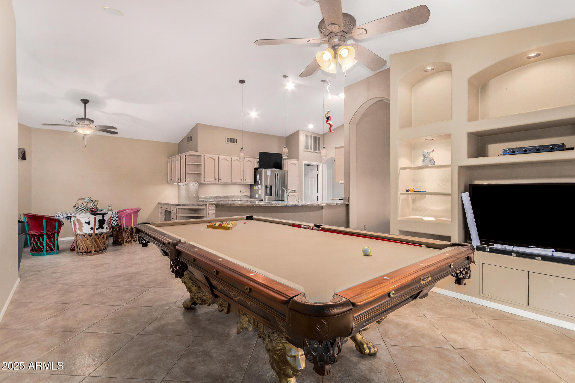 15531 Piccadilly Road Goodyear, AZ 85395 - Photo 22 of 54 a room with pool table and flat screen tv