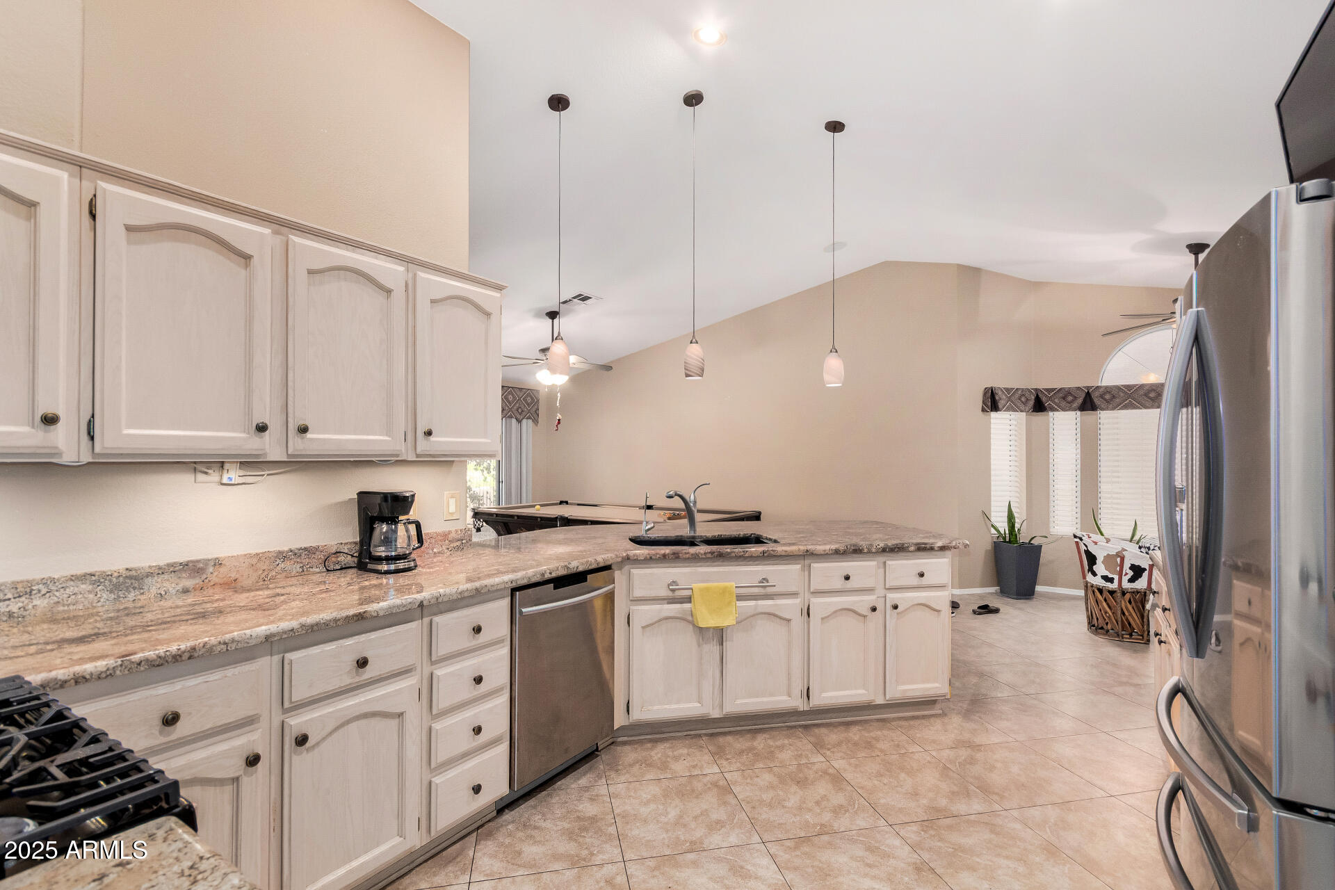 15531 Piccadilly Road Goodyear, AZ 85395 - Photo 26 of 54 a kitchen with a sink window and cabinets
