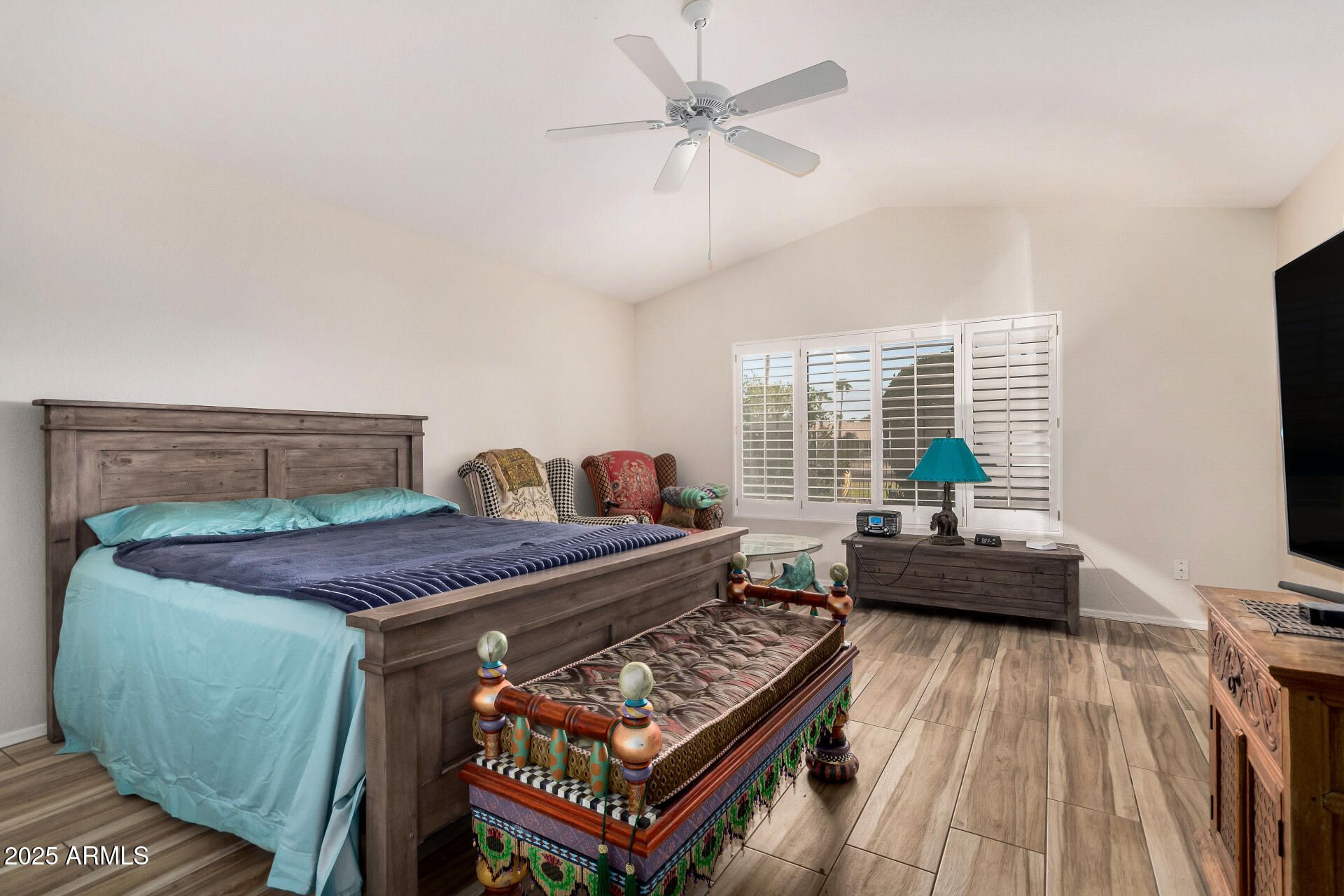 15531 Piccadilly Road Goodyear, AZ 85395 - Photo 28 of 54 a bed room with furniture and a flat screen tv
