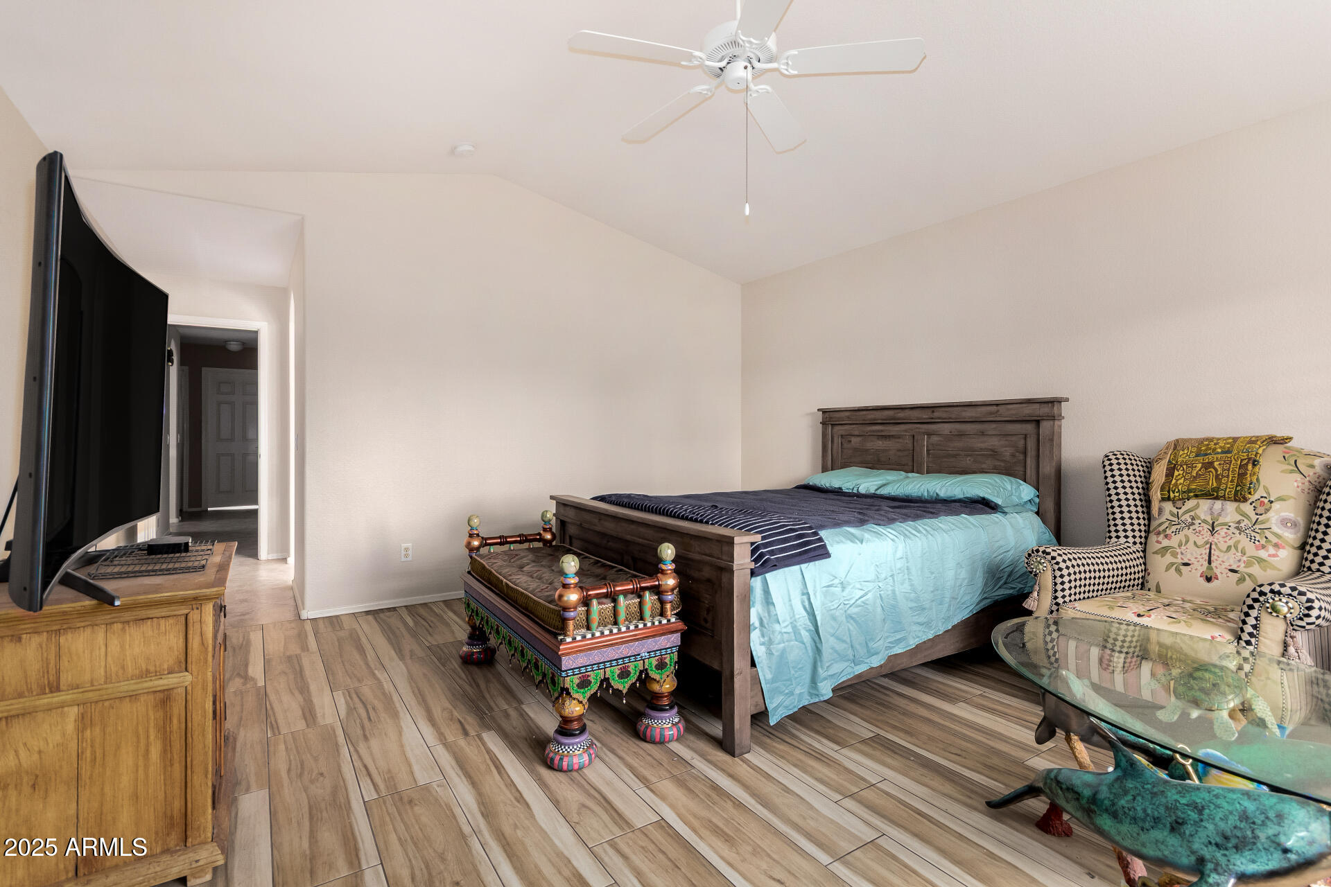 15531 Piccadilly Road Goodyear, AZ 85395 - Photo 29 of 54 a bedroom with bed and flat tv screen