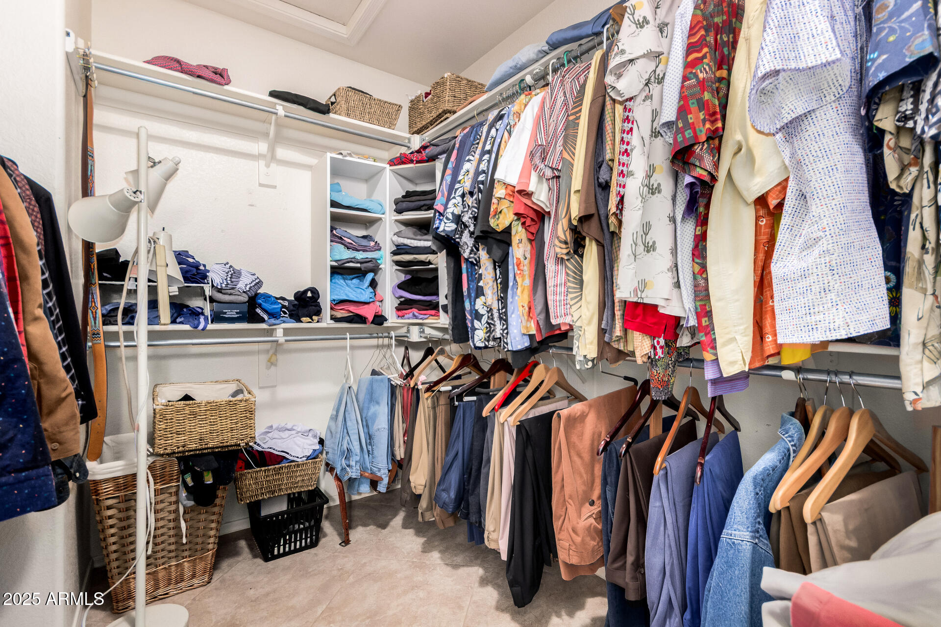 15531 Piccadilly Road Goodyear, AZ 85395 - Photo 35 of 54 a view of walk in closet with clothes and shoes