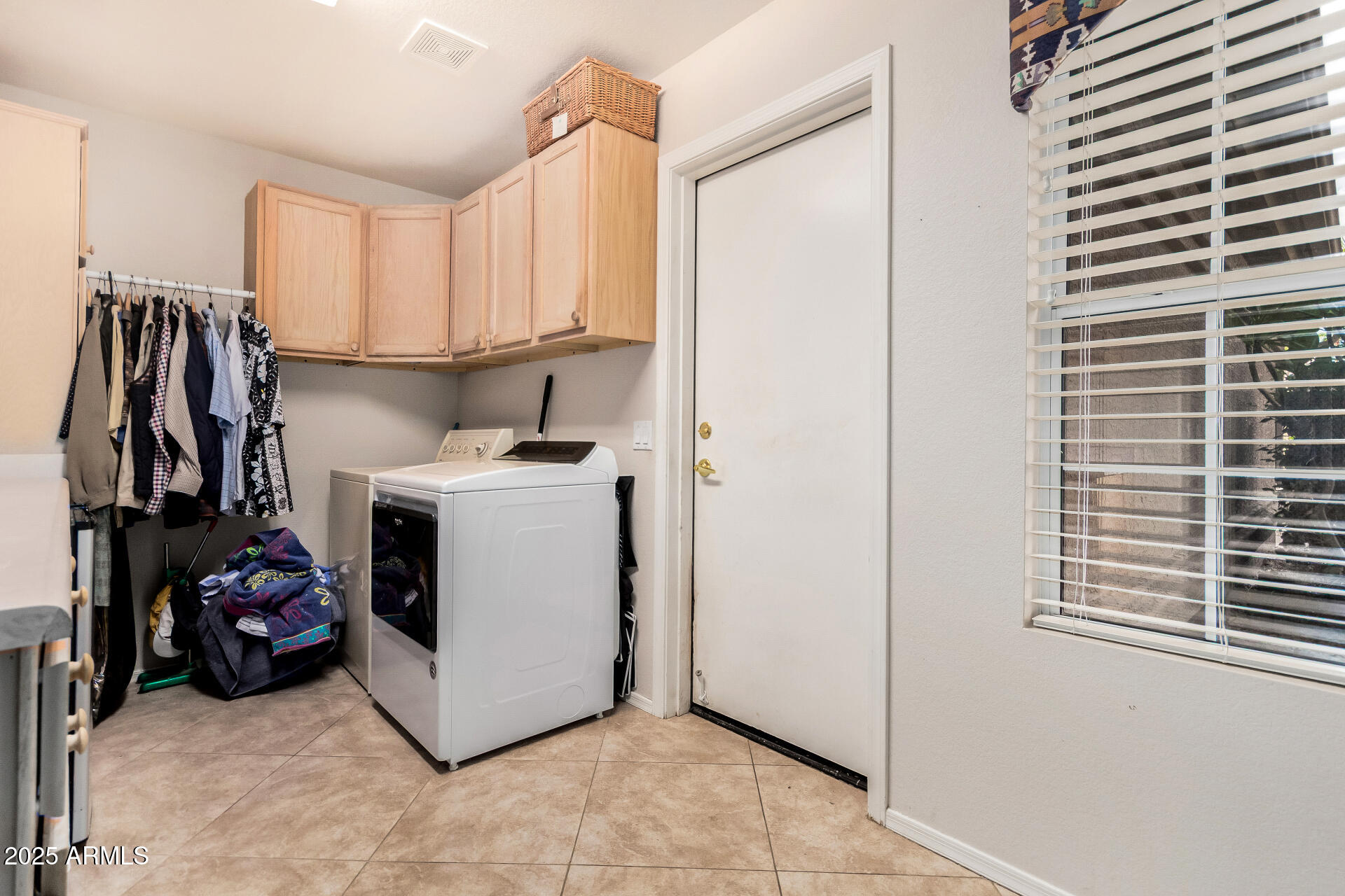 15531 Piccadilly Road Goodyear, AZ 85395 - Photo 36 of 54 a utility room with sink dryer and washer