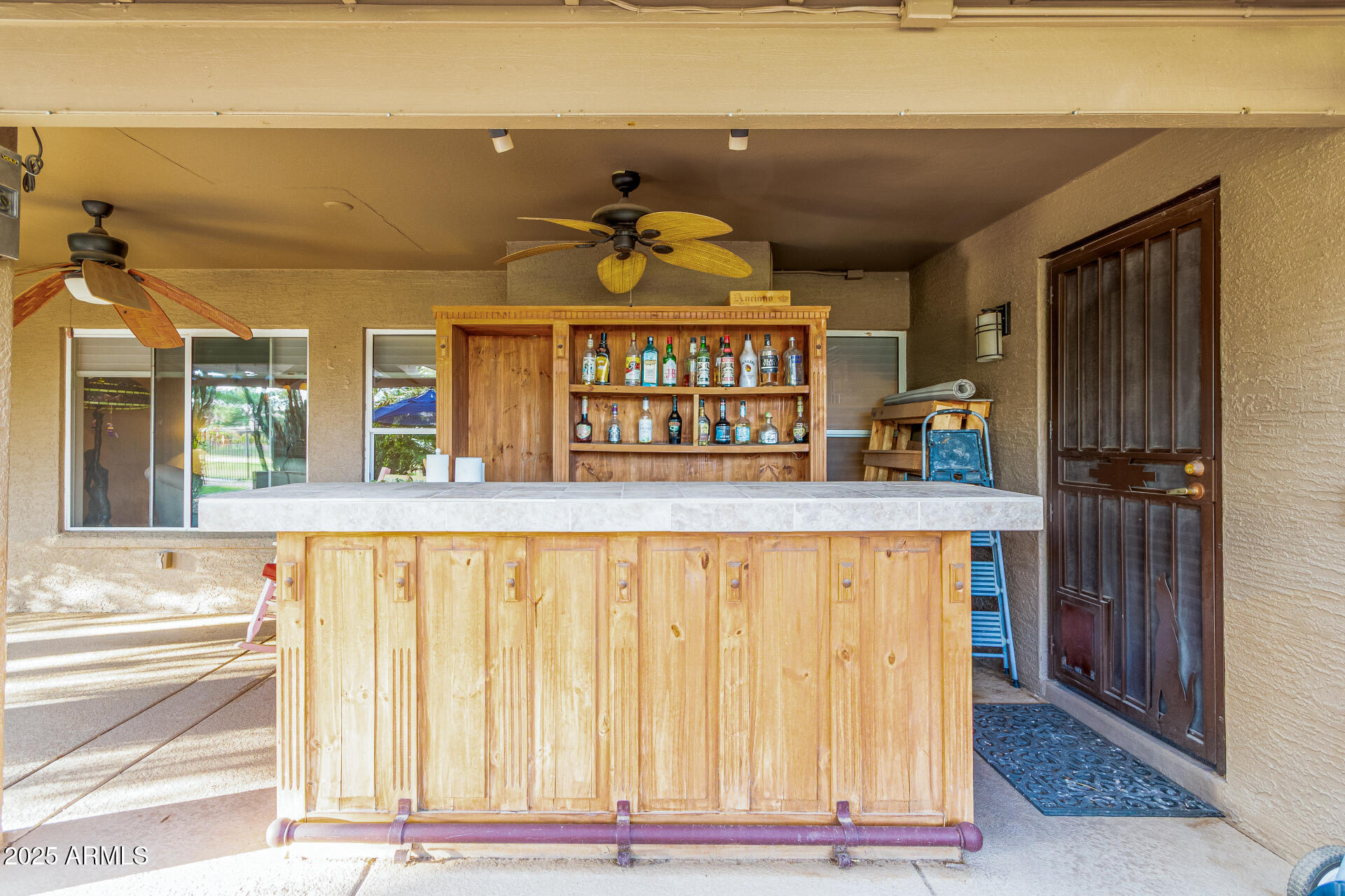 15531 Piccadilly Road Goodyear, AZ 85395 - Photo 48 of 54 a view of kitchen with granite countertop window and a refrigerator