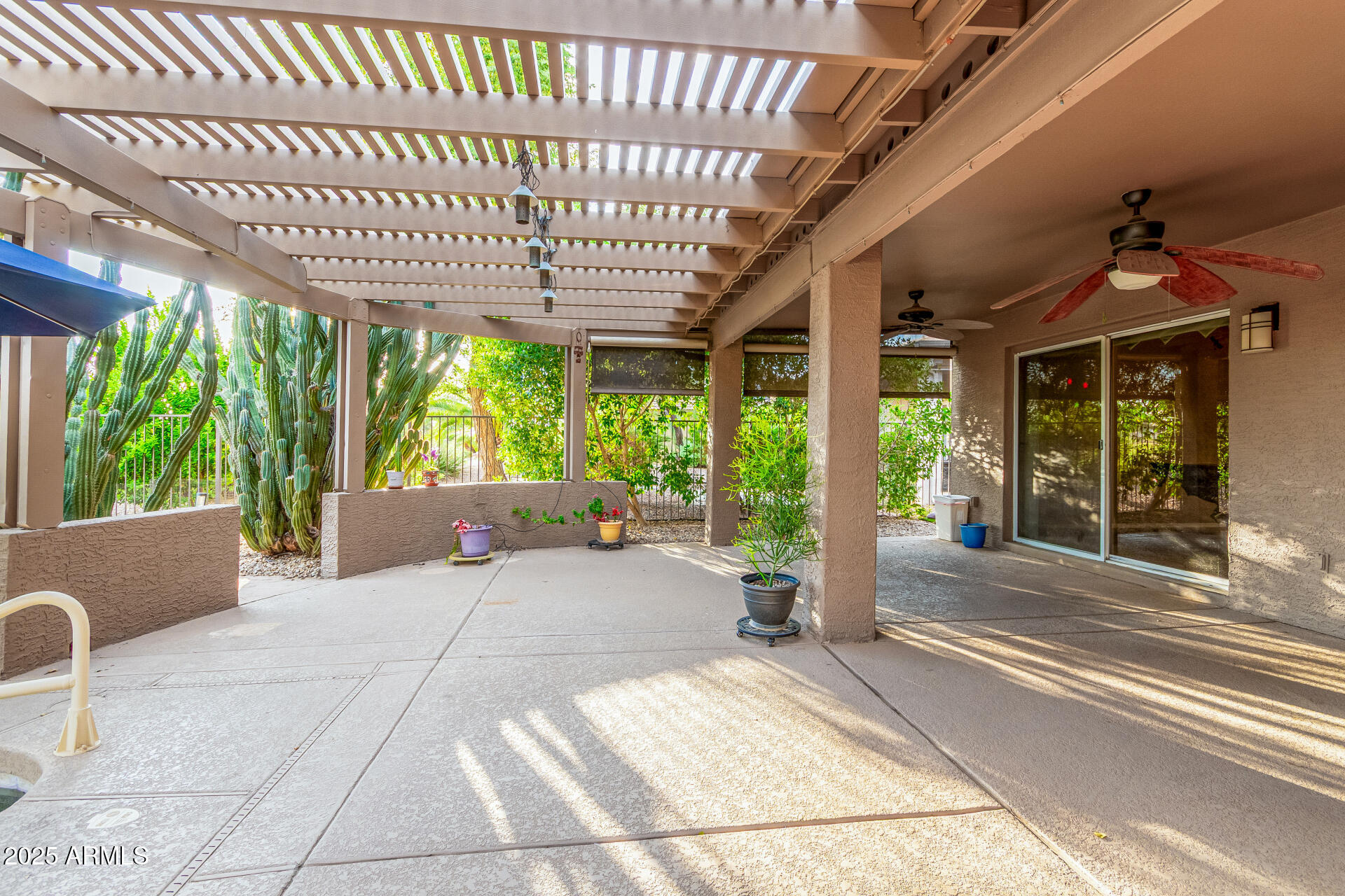 15531 Piccadilly Road Goodyear, AZ 85395 - Photo 49 of 54 a outdoor space with the couches and dining table with the garden view
