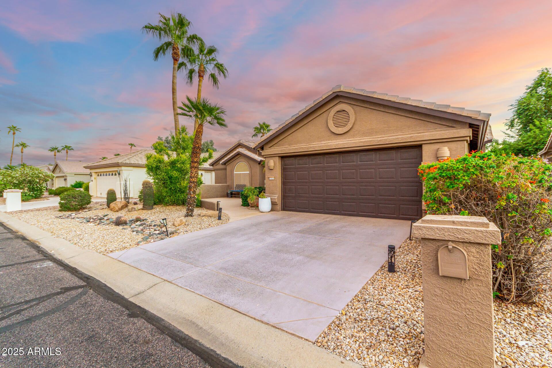 15531 Piccadilly Road Goodyear, AZ 85395 - Photo 5 of 54 a front view of a house with a yard and garage