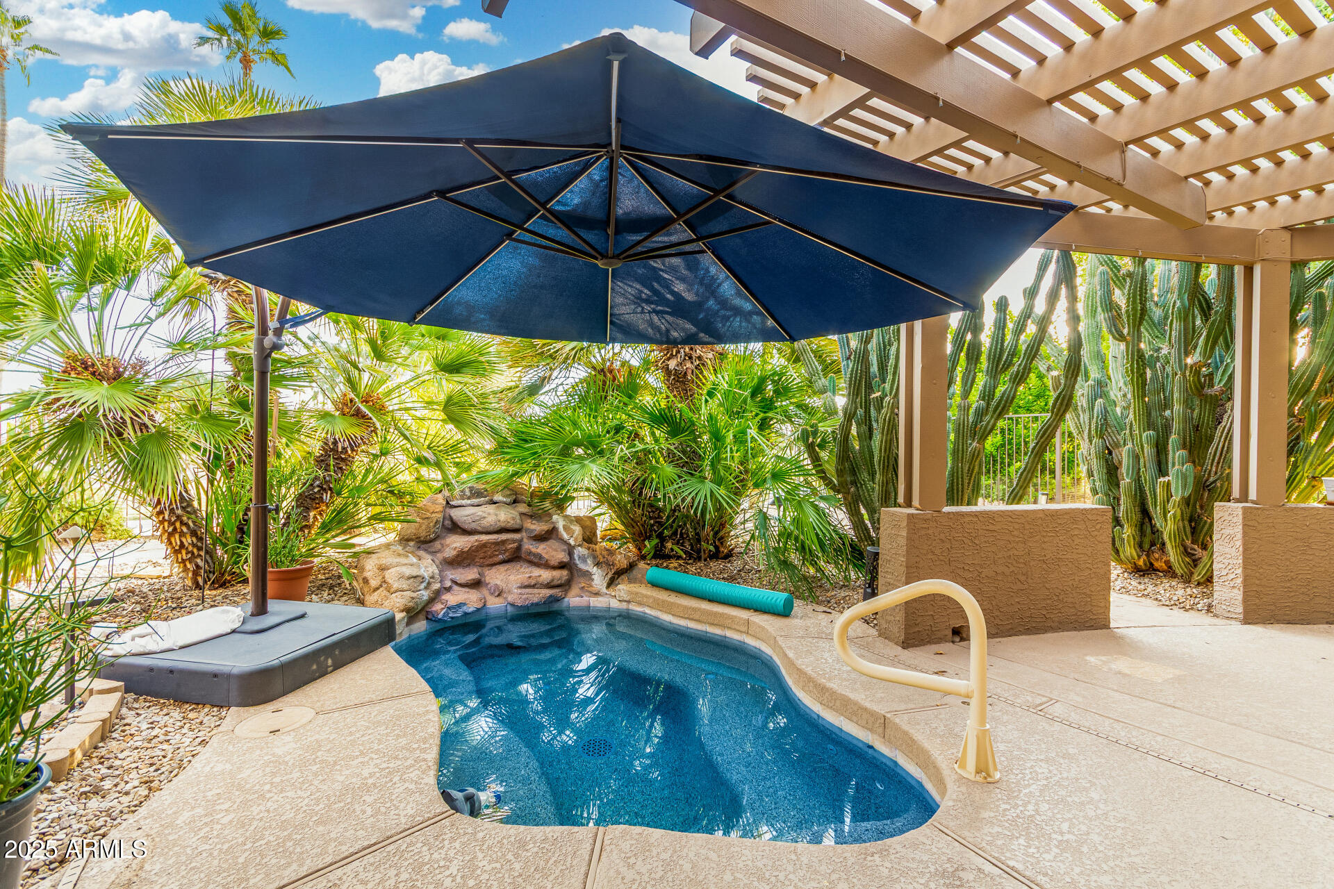15531 Piccadilly Road Goodyear, AZ 85395 - Photo 54 of 54 a roof deck with table and chairs under an umbrella