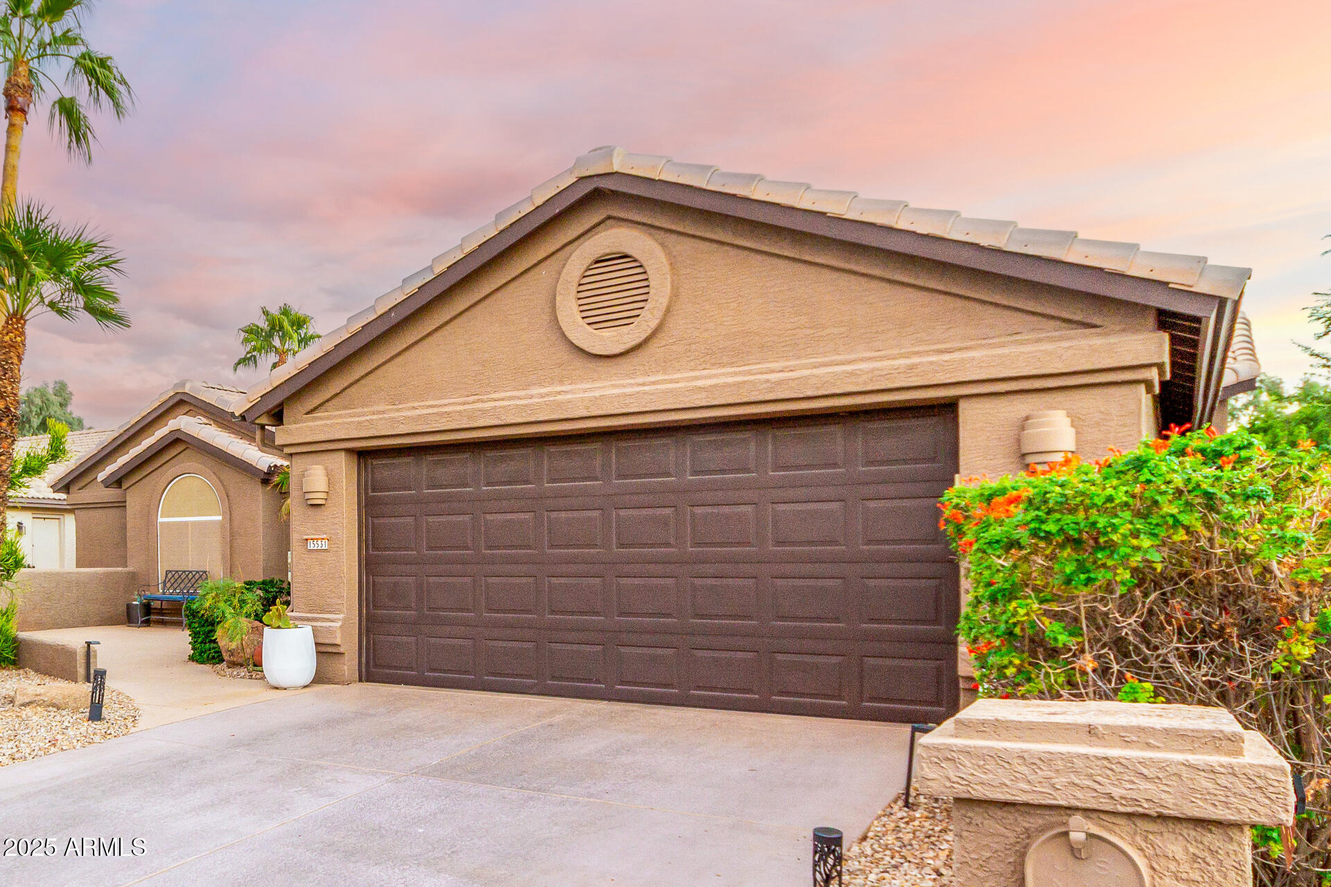 15531 Piccadilly Road Goodyear, AZ 85395 - Photo 6 of 54 a front view of a house with a garden
