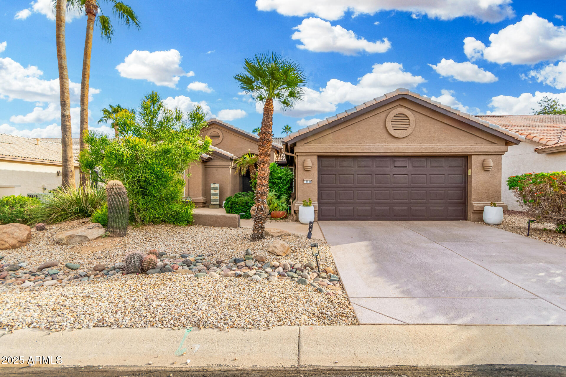 15531 Piccadilly Road Goodyear, AZ 85395 - Photo 7 of 54 a front view of a house with garden