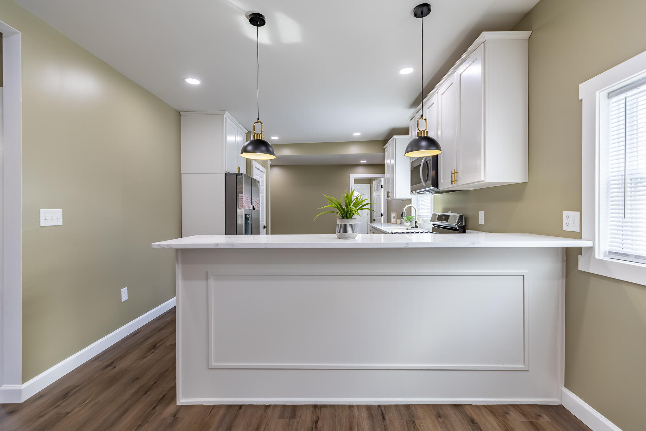 1047 Arizona Street Gary, IN 46403 - Photo 11 of 35 a view of a kitchen with a sink and wooden floor