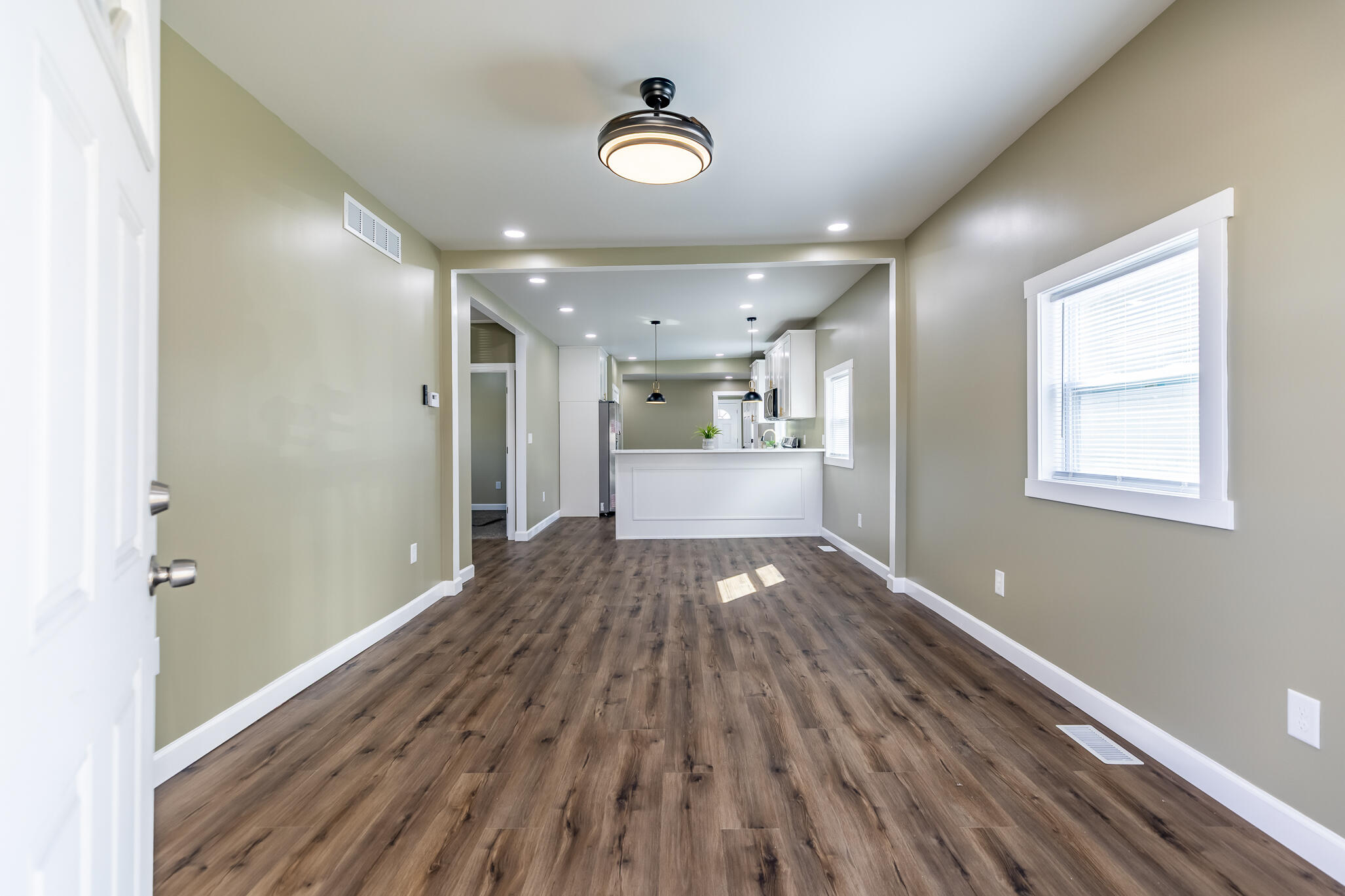 1047 Arizona Street Gary, IN 46403 - Photo 5 of 35 a view of a room with wooden floor and window