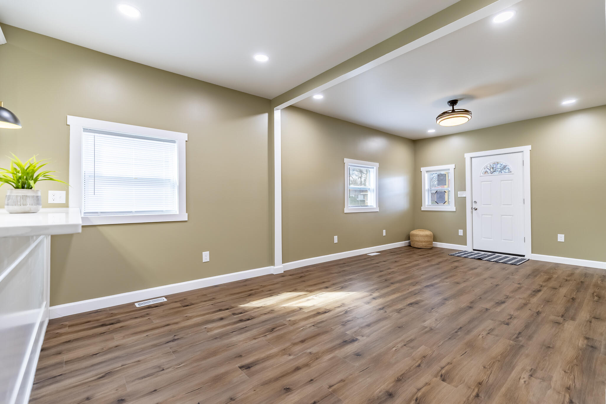 1047 Arizona Street Gary, IN 46403 - Photo 7 of 35 a view of empty room with wooden floor and fan