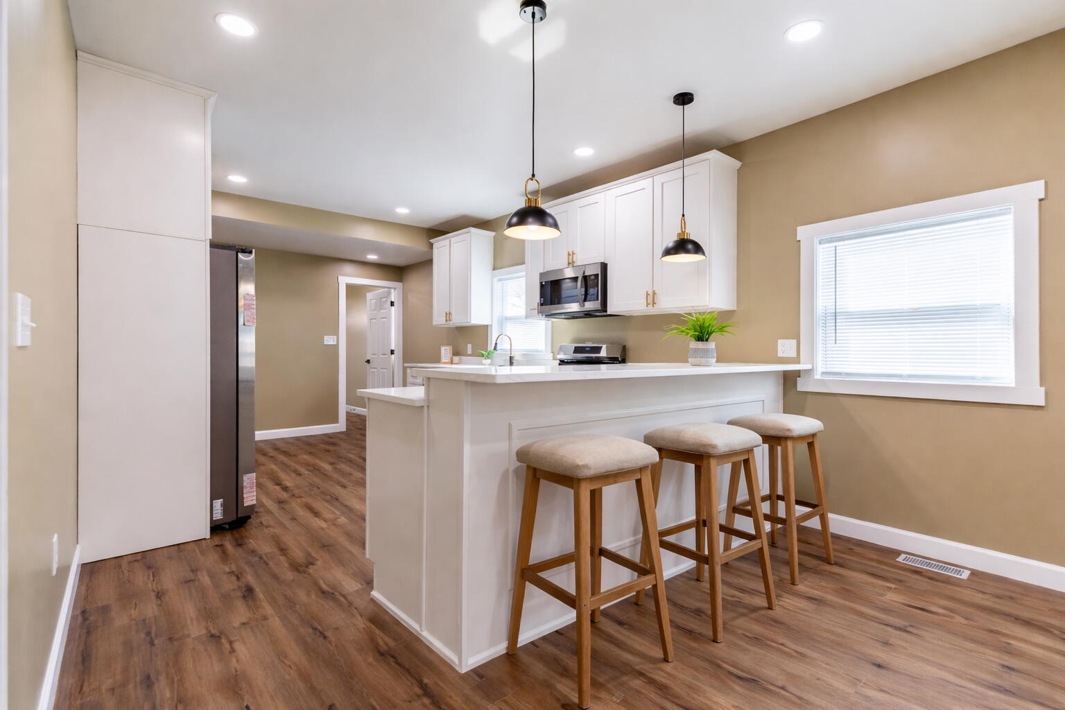 1047 Arizona Street Gary, IN 46403 - Photo 8 of 35 a kitchen with kitchen island a wooden floor and a counter top space