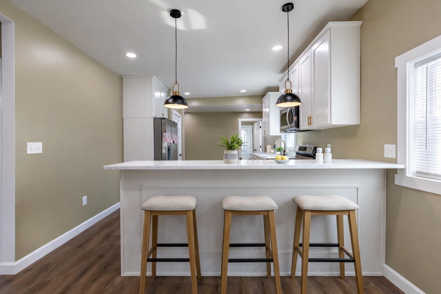 1047 Arizona Street Gary, IN 46403 - Photo 10 of 35 a kitchen with kitchen island a dining table chairs cabinets and a sink