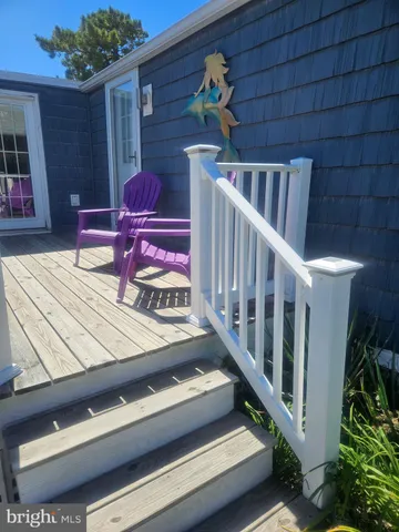 a view of a chairs and tables in the balcony