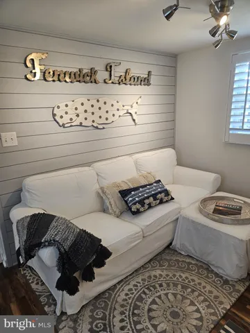 a black and white photo of a couch in a bathroom