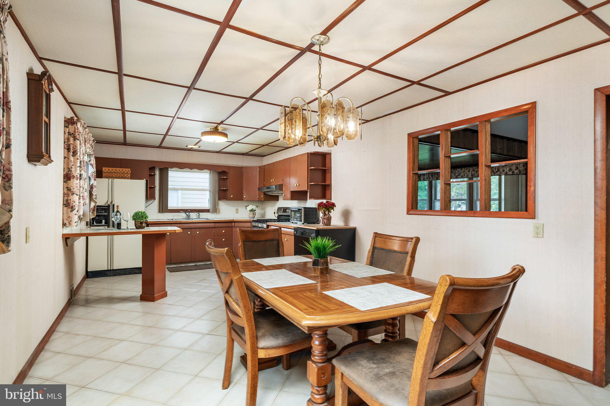 44 Falmouth Road Hamilton, NJ 08620 - Photo 4 of 27 a view of a dining room with furniture and a chandelier