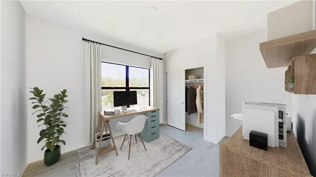 a workspace with furniture and a potted plant