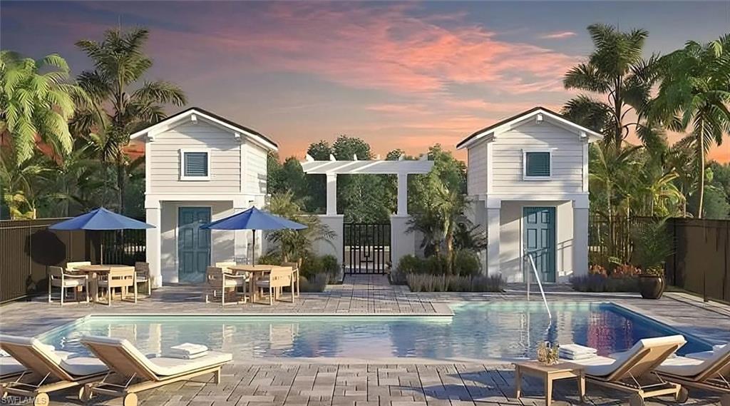 3089 Juniper Way Naples, FL 34112 - Photo 27 of 28 front view of house with a yard