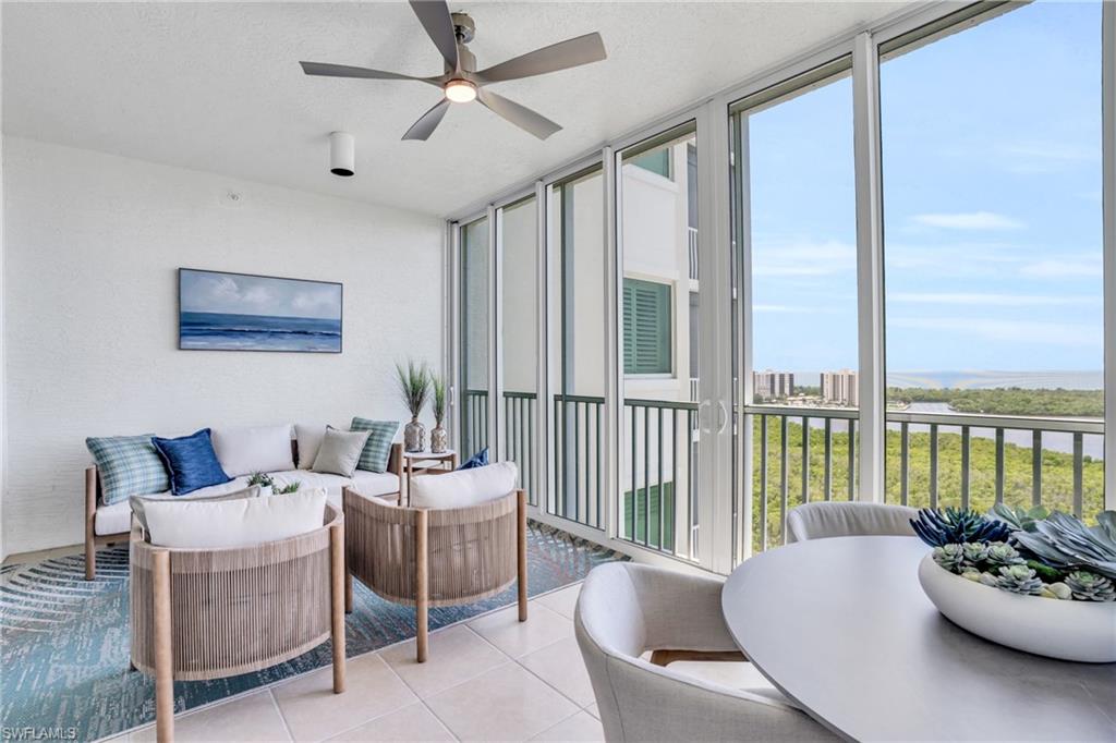 265 Indies Way, Unit 1404 Naples, FL 34110 - Photo 32 of 42 Sunroom / solarium featuring ceiling fan