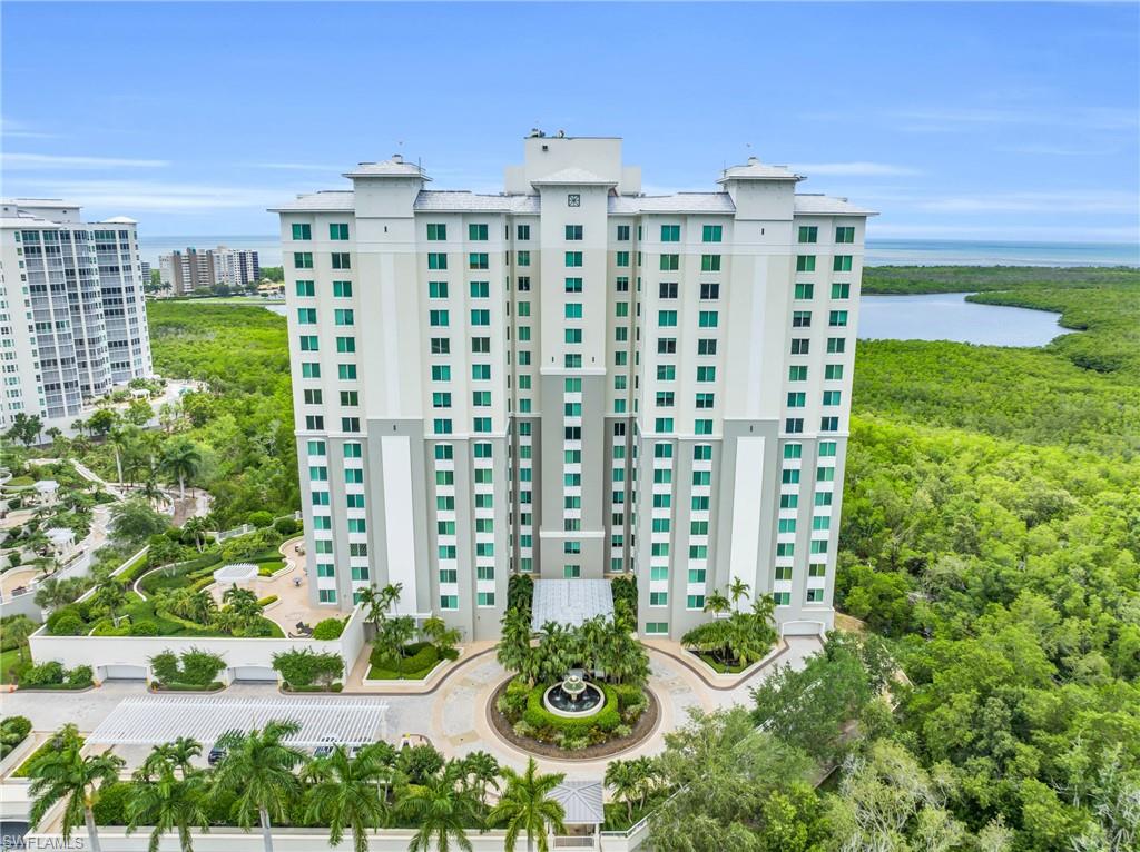 265 Indies Way, Unit 1404 Naples, FL 34110 - Photo 39 of 42 View of building exterior featuring a water view