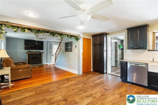 a bedroom with a bed and dresser with mirror