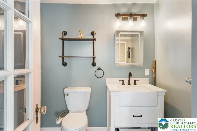 a front view of a building with a yard