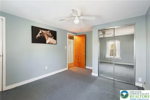a hallway with furniture and closet