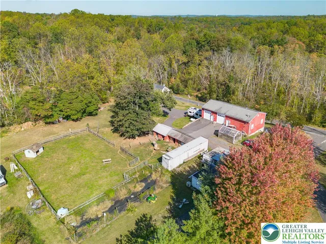 a large kitchen with a stove a refrigerator and a sink