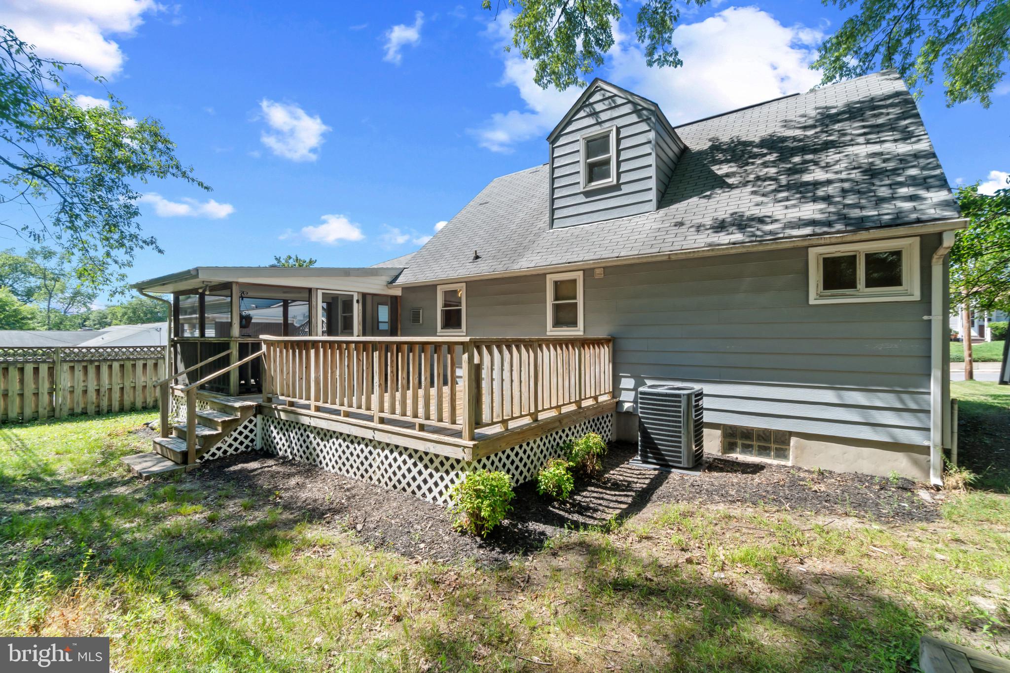 415 Baylor Road Glen Burnie, MD 21061 - Photo 24 of 29 a view of a house with a wooden deck and a yard