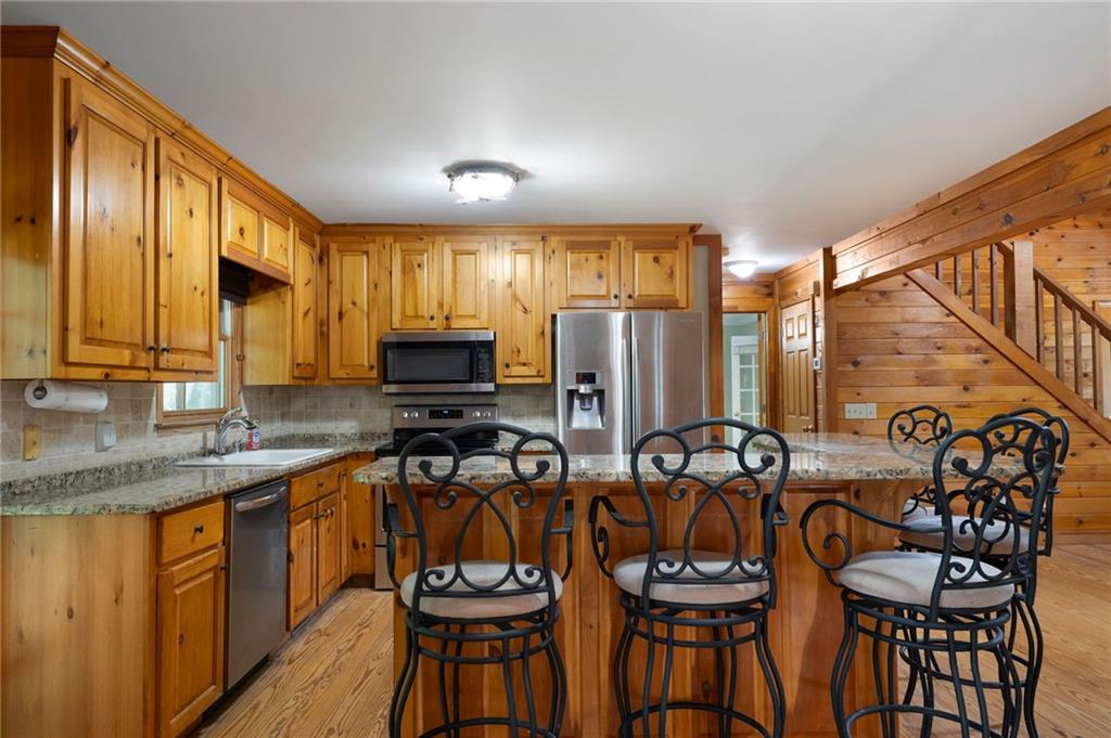 442 Cartecay River Run Ellijay, GA 30536 - Photo 16 of 63 a view of a kitchen with granite countertop lots of counter top space and stainless steel appliances