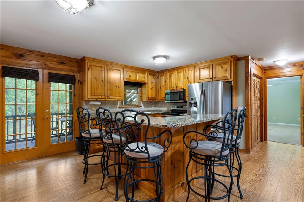 442 Cartecay River Run Ellijay, GA 30536 - Photo 17 of 63 a view of a dining room with furniture window and wooden floor