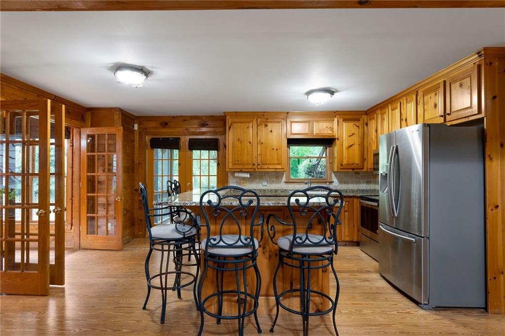 442 Cartecay River Run Ellijay, GA 30536 - Photo 18 of 63 a view of a dining room with furniture window and wooden floor