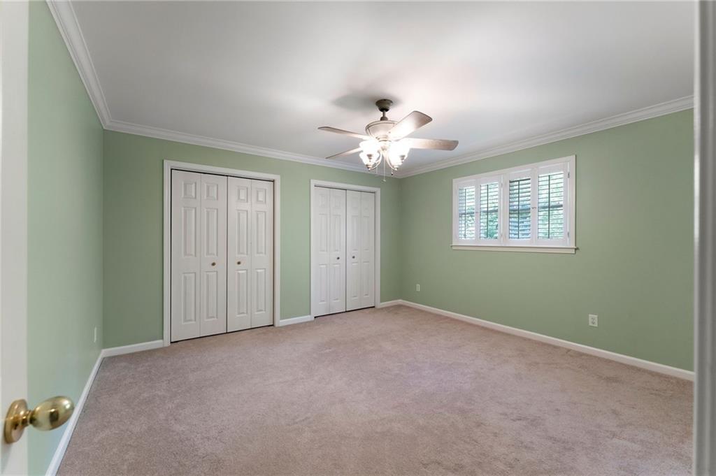 442 Cartecay River Run Ellijay, GA 30536 - Photo 37 of 63 an empty room with chandelier fan and windows