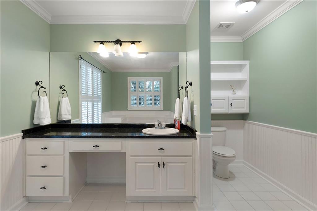 442 Cartecay River Run Ellijay, GA 30536 - Photo 41 of 63 a bathroom with a granite countertop sink mirror and a bathtub