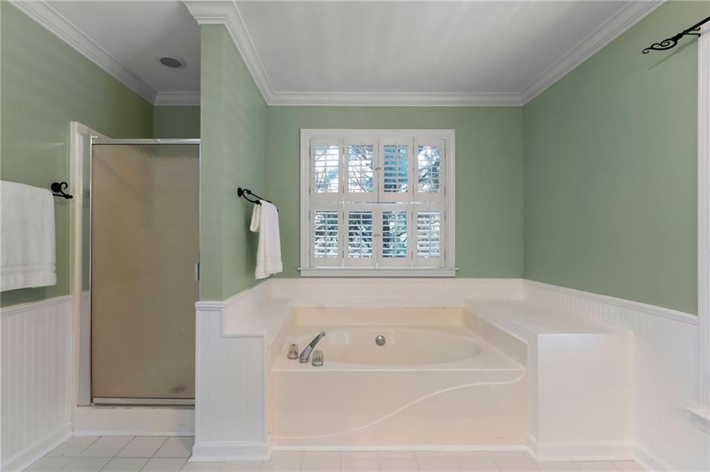 442 Cartecay River Run Ellijay, GA 30536 - Photo 42 of 63 a bathroom with bathtub and window