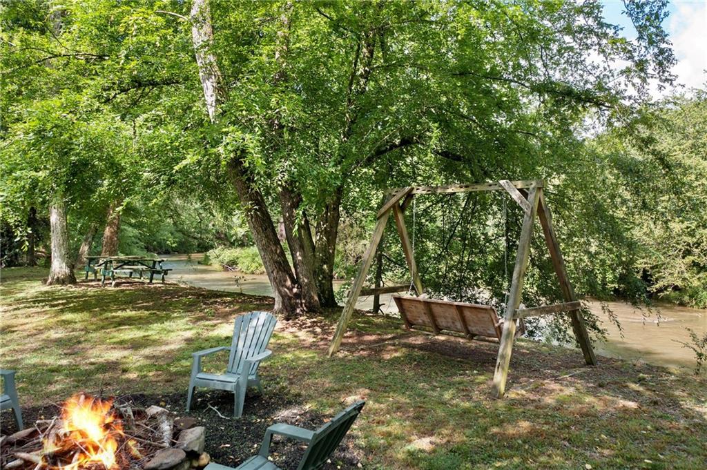 442 Cartecay River Run Ellijay, GA 30536 - Photo 48 of 63 a view of a yard with patio