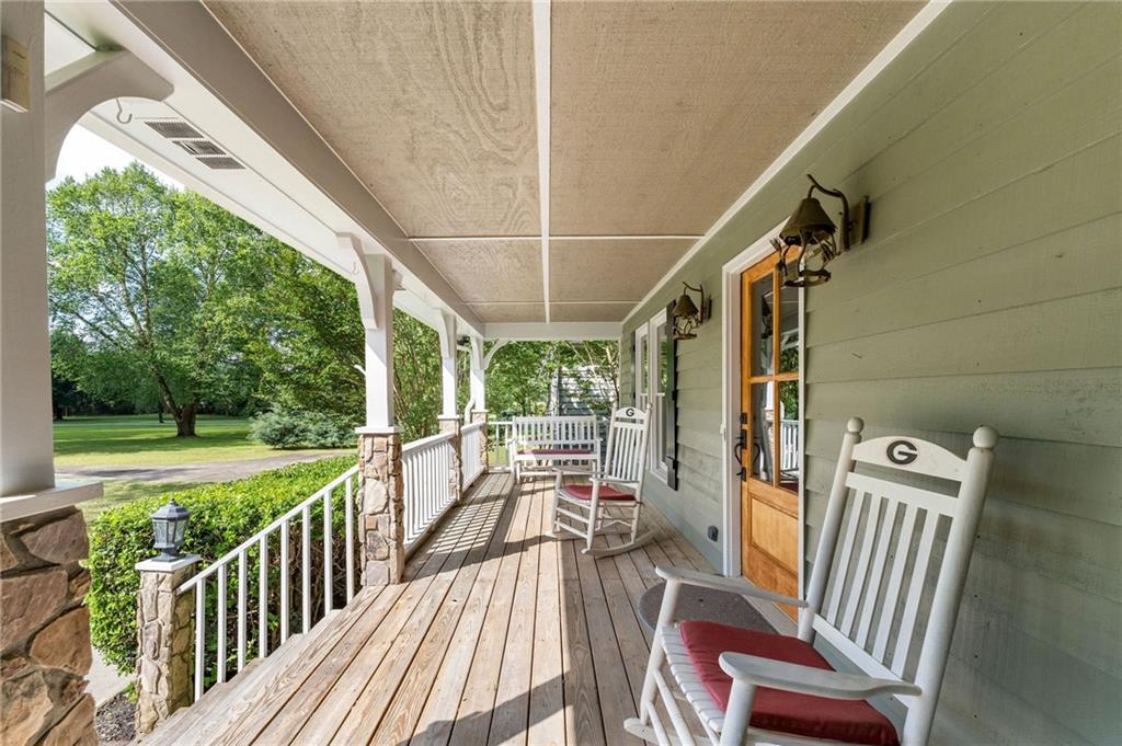 442 Cartecay River Run Ellijay, GA 30536 - Photo 5 of 63 a view of a chairs and table in patio with wooden floor