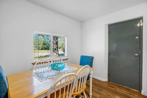 a view of a dining room with furniture window and outside view