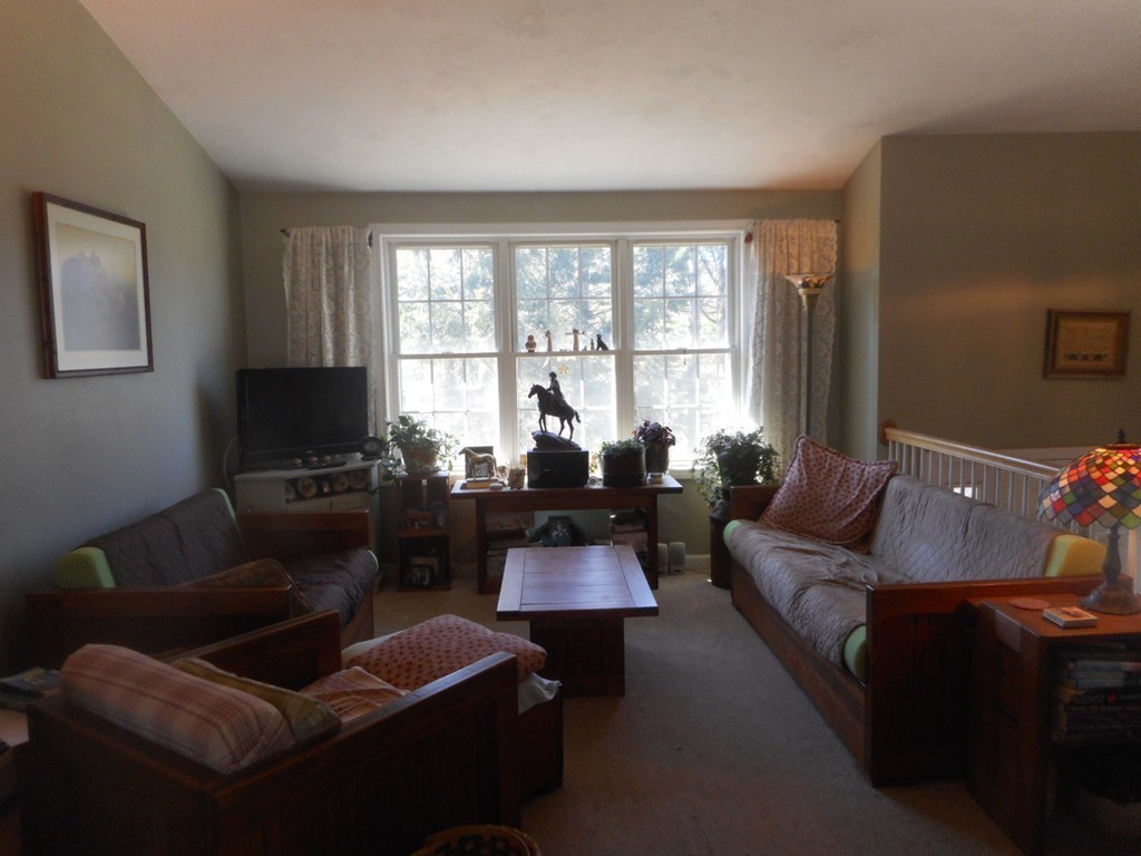 200 West Orange Road Orange, MA 01364 - Photo 16 of 24 a living room with furniture and a flat screen tv