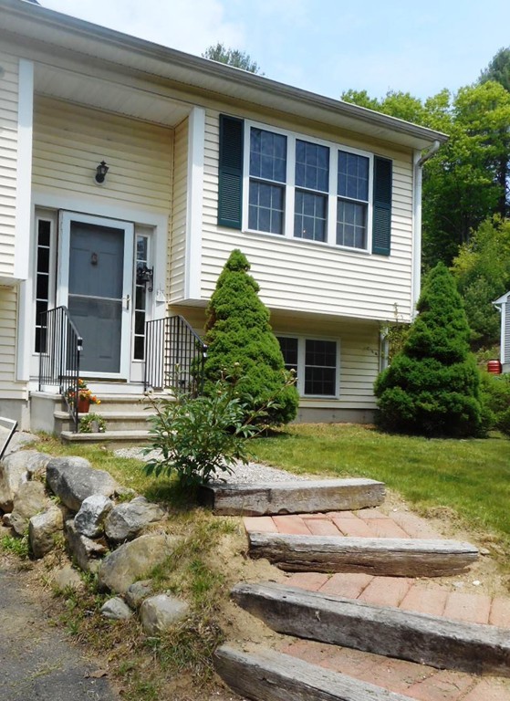 200 West Orange Road Orange, MA 01364 - Photo 2 of 24 a front view of a house with a garden