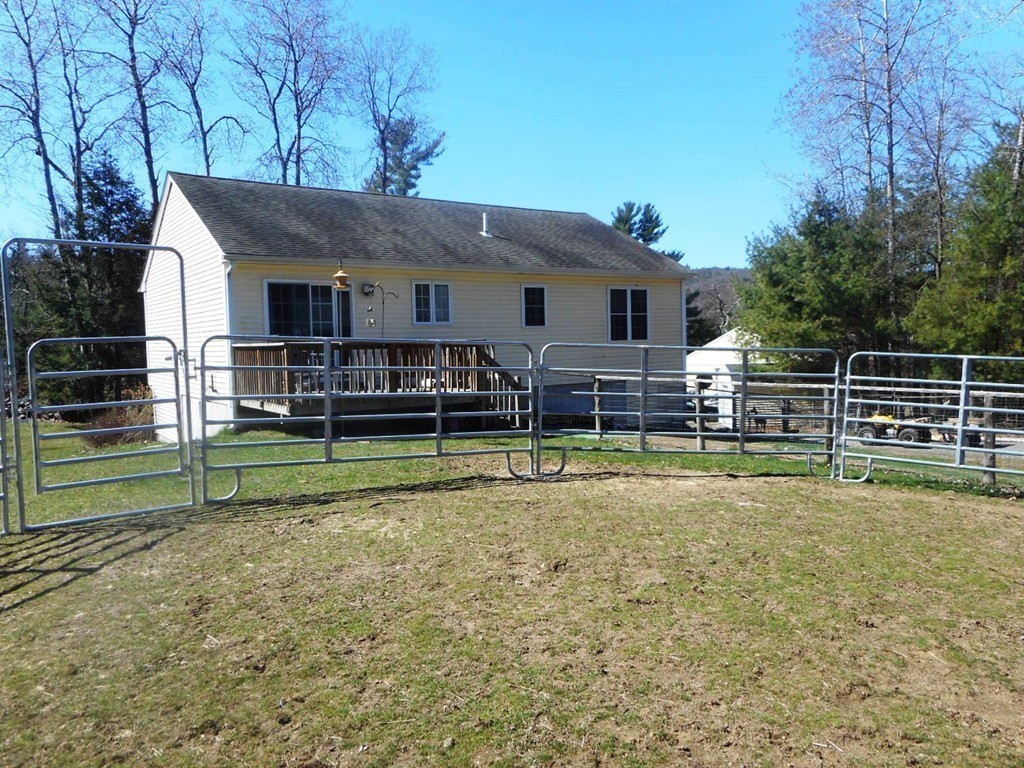 200 West Orange Road Orange, MA 01364 - Photo 5 of 24 a view of a house with swimming pool next to a yard