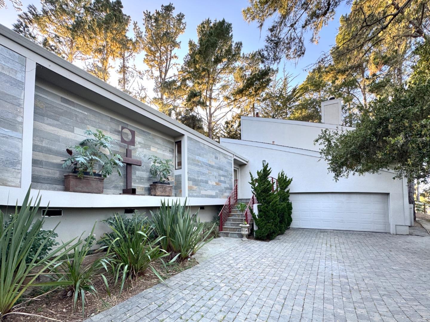 a front view of a house with garden