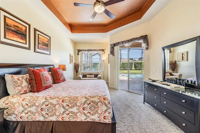 a bedroom with a large bed and a large window