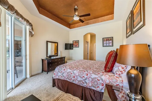 a bedroom with a bed and dresser with mirror