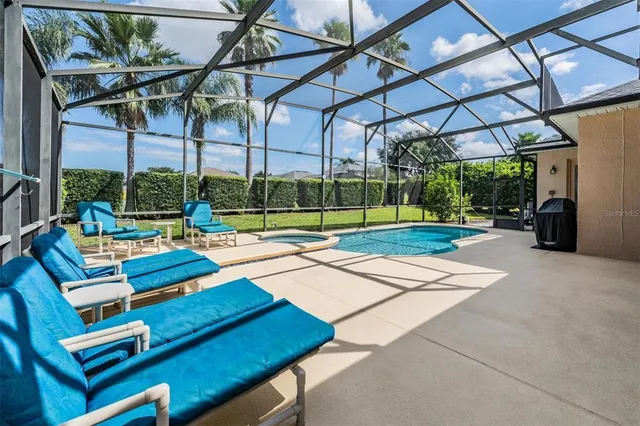 a view of a swimming pool with a patio